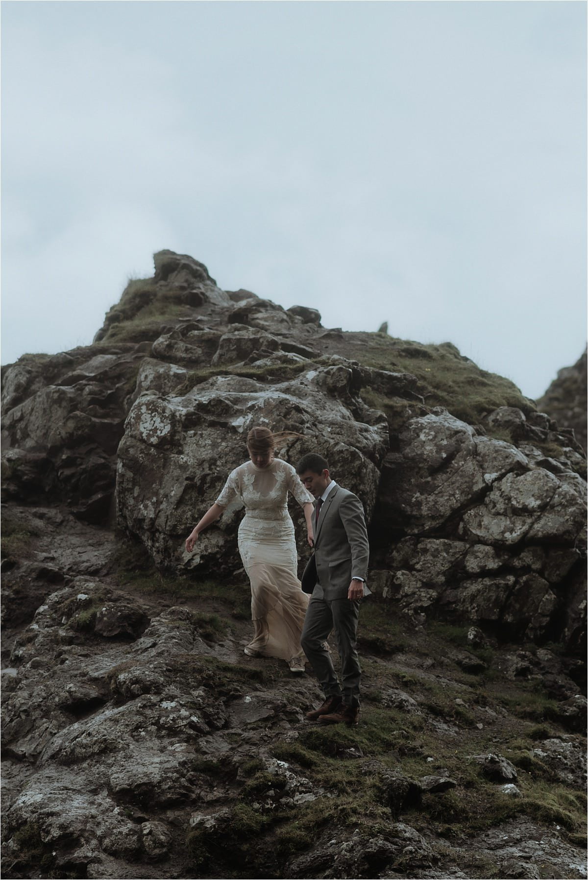 couple walking on the isle of skye during old man of storr elopement