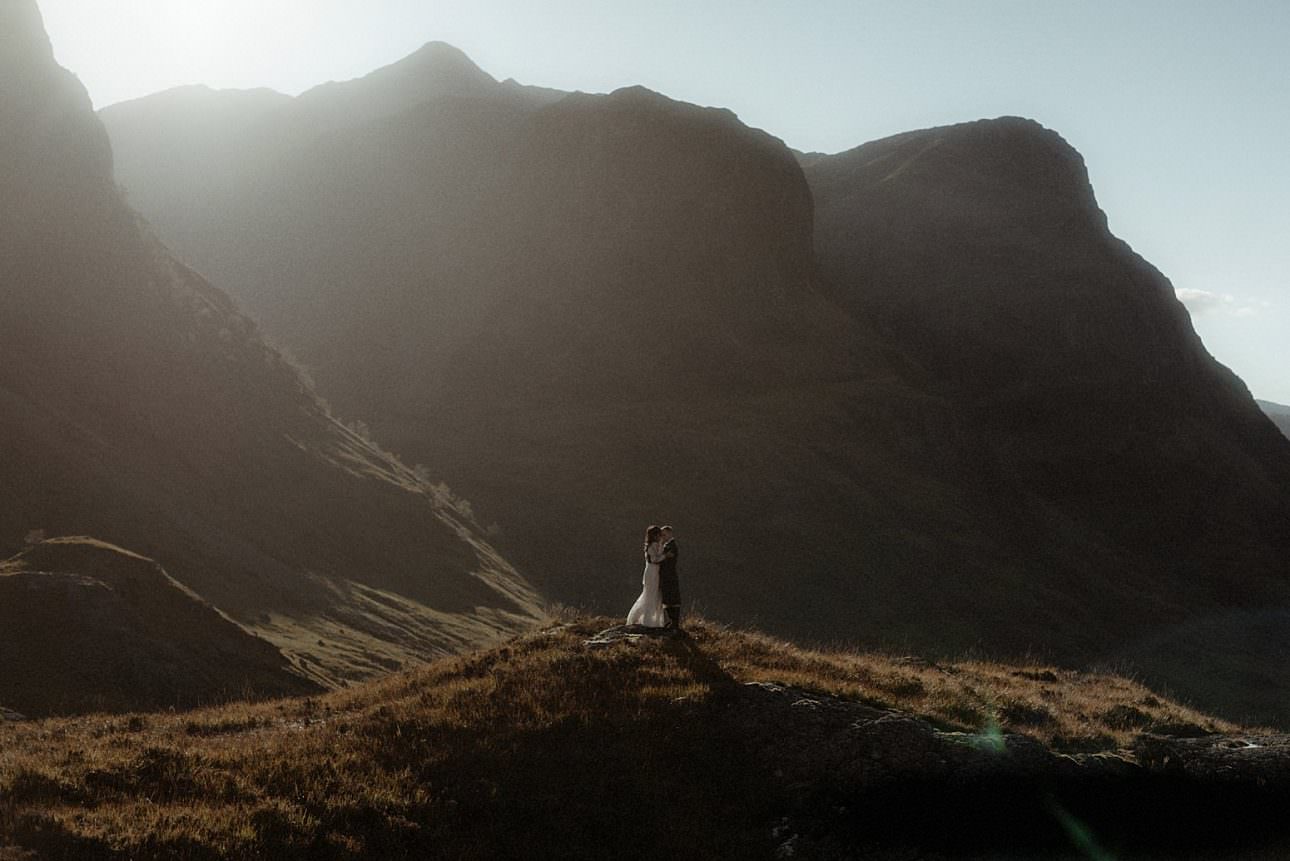 Glencoe elopement couple standing in the mountains 