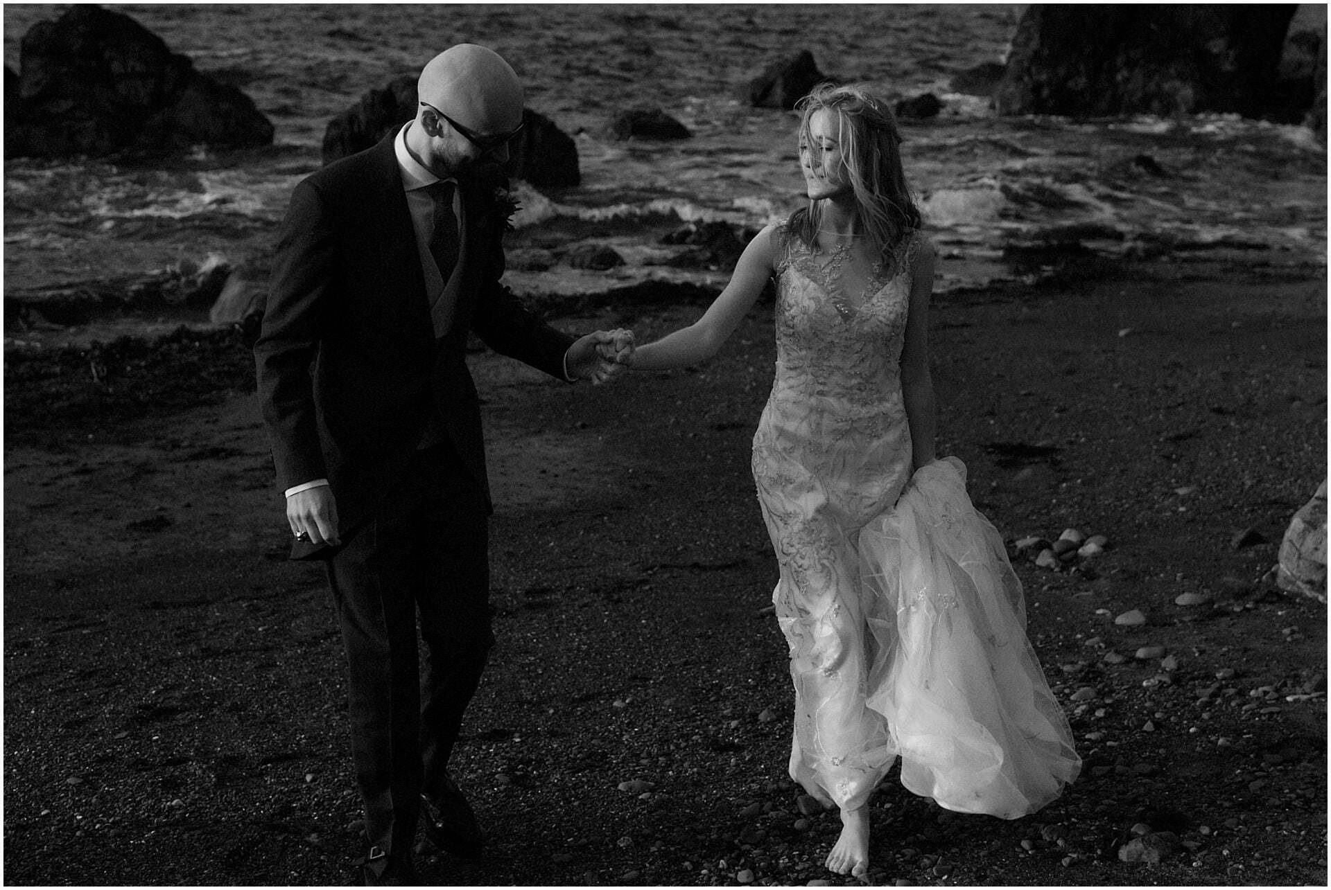 scotland elopement bride  and groom walking on a beach