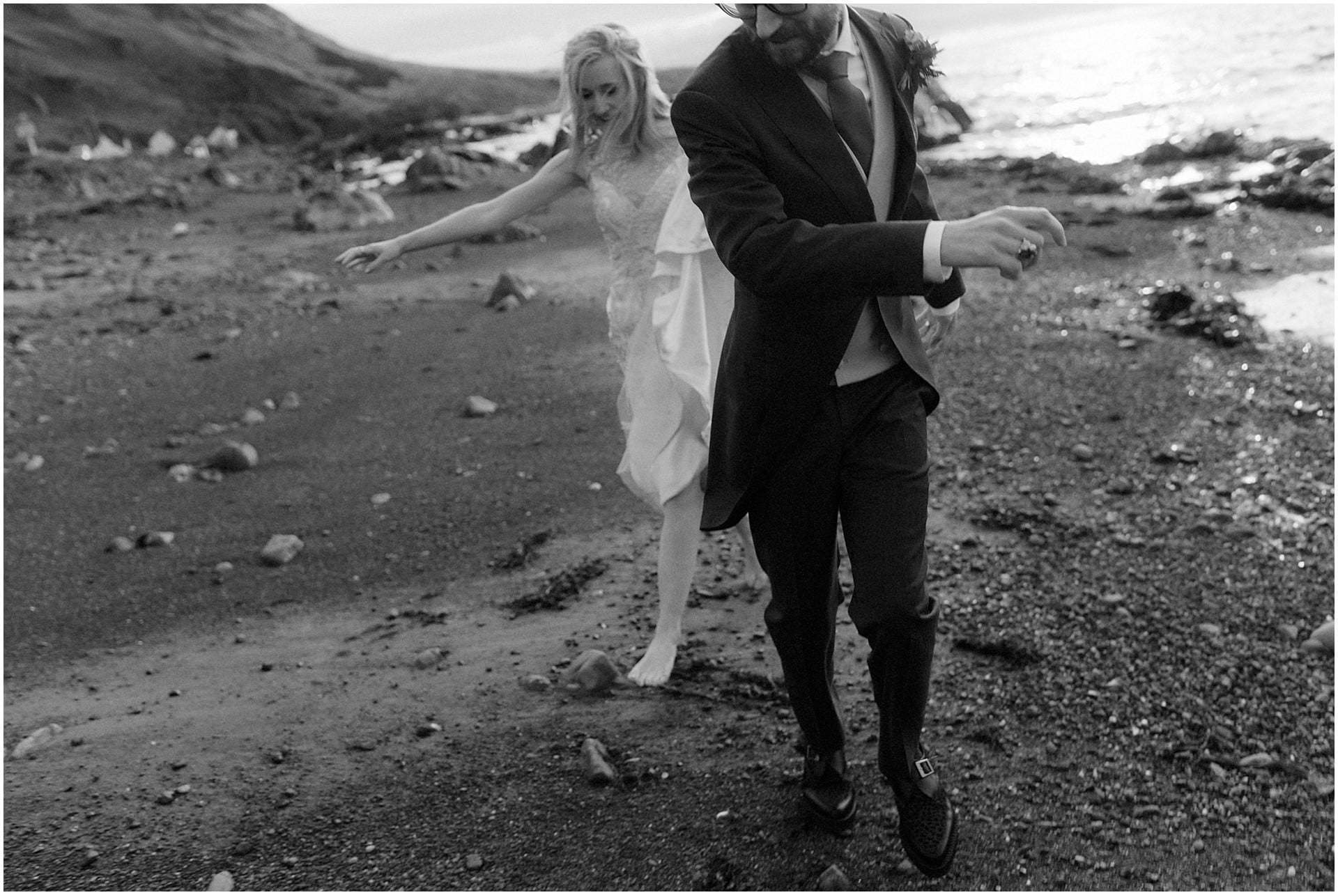 Scotland elopement on the West coast couple walking on beach