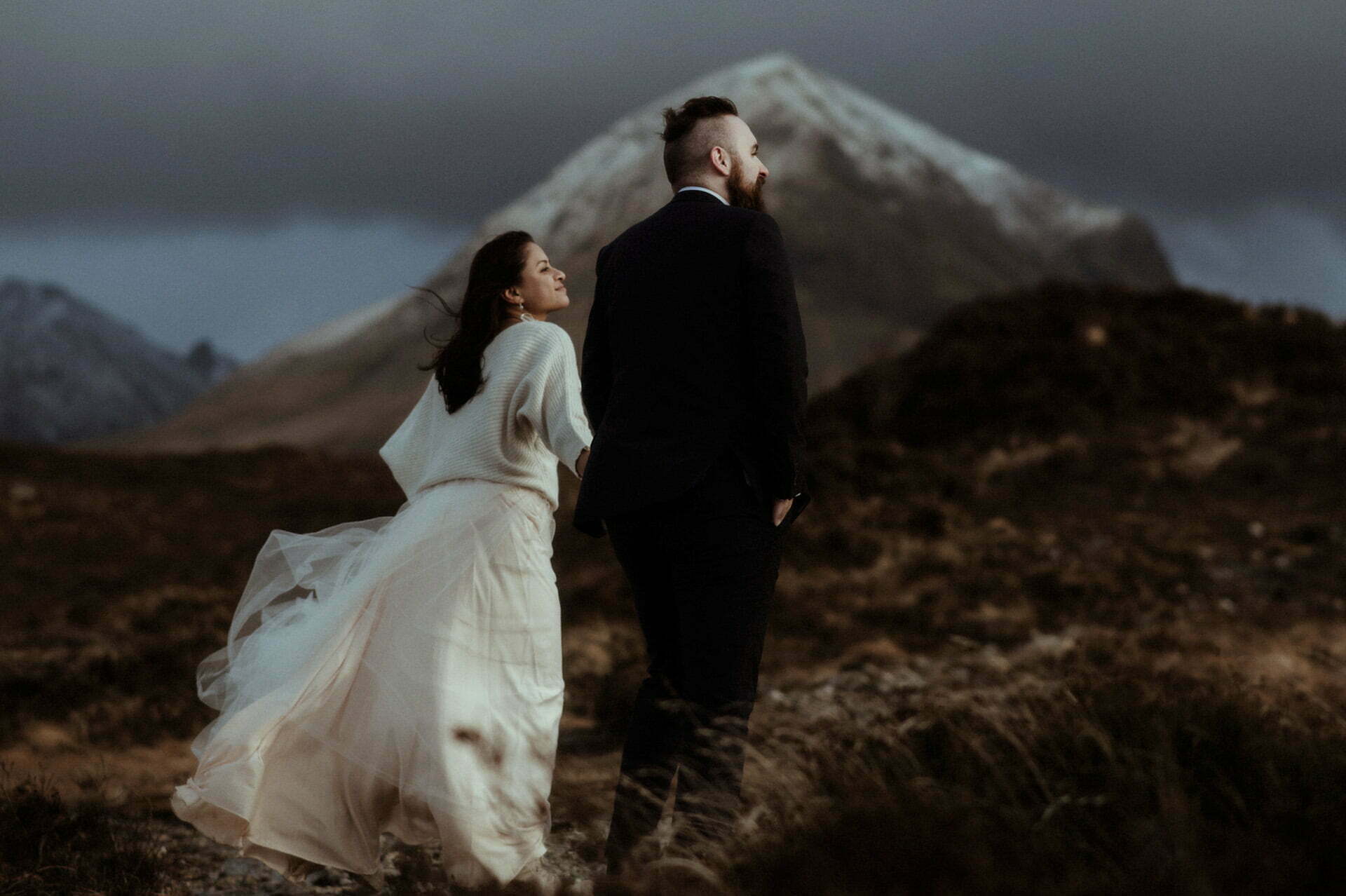 elopement couple walking in the cuillins on Skye