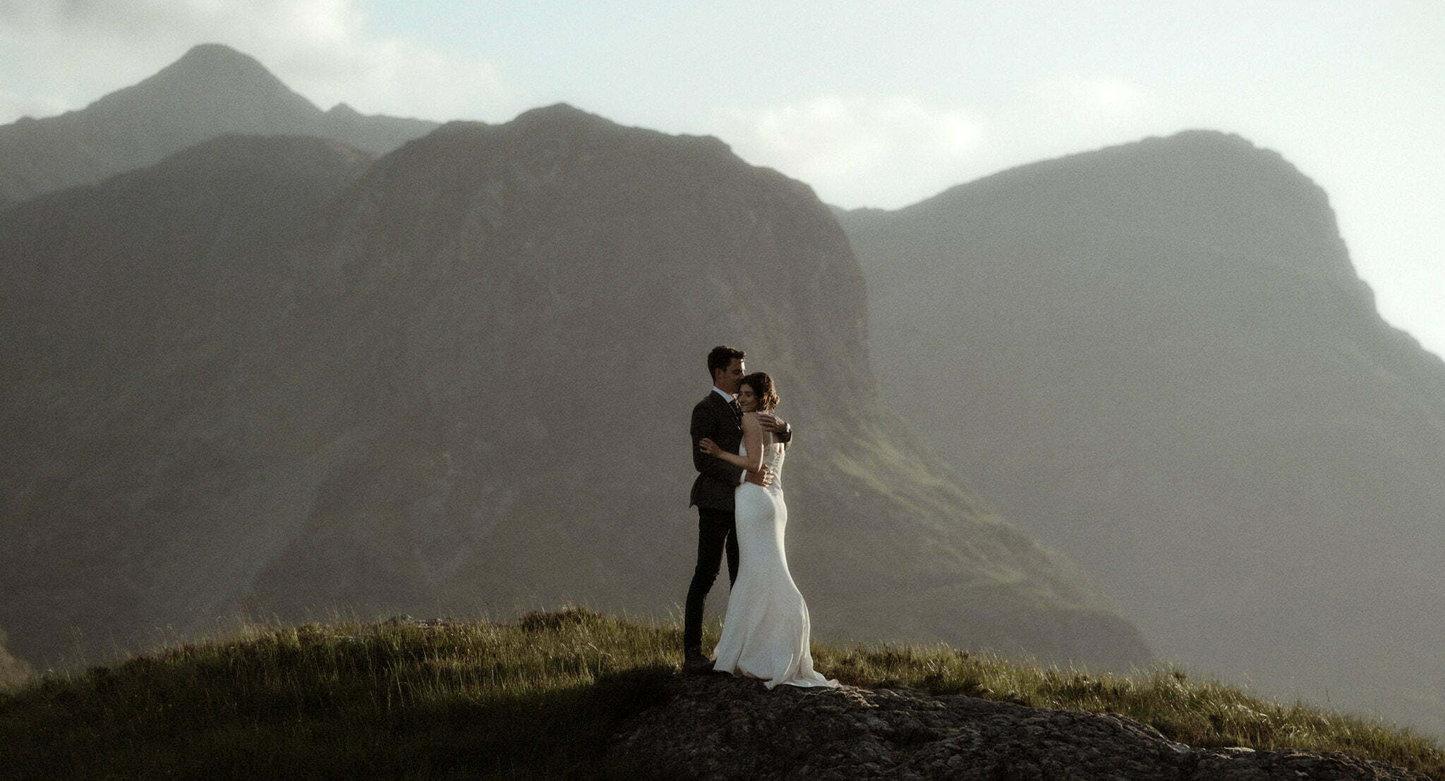 scotland wedding photographer in Glencoe with an elopement couple walking in the mountains