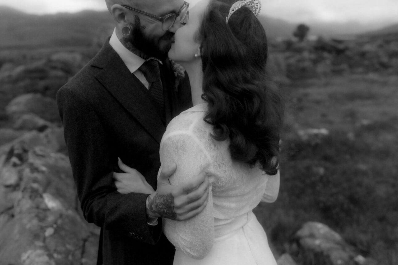couple embracing in the mountains after thier shieldaig lodge wedding