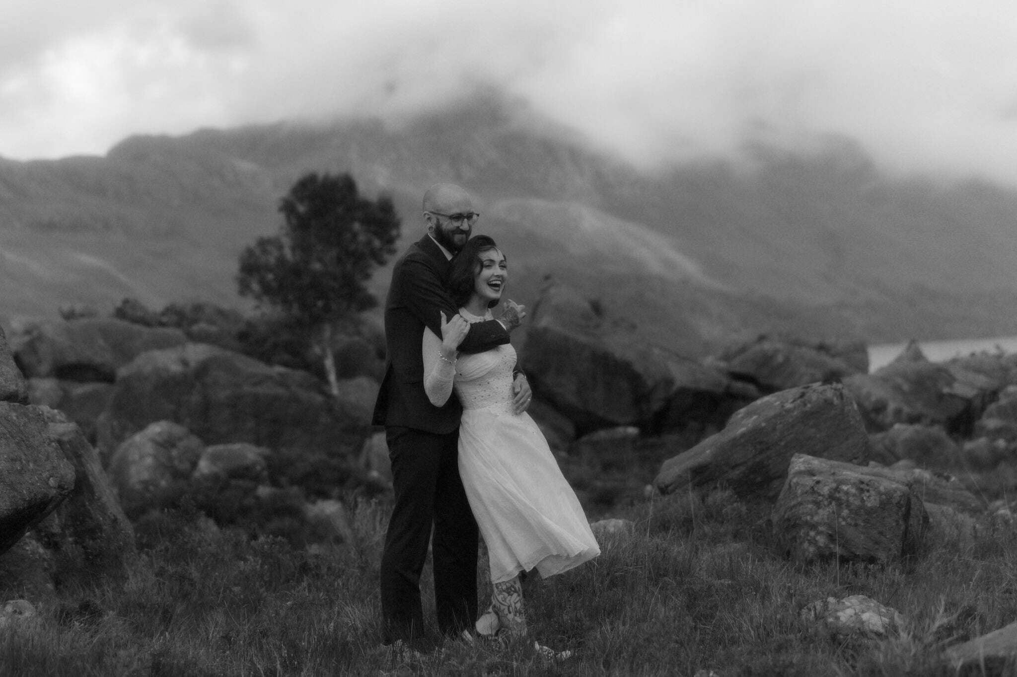 torridon elopement in scotland with couple standing near the mountains