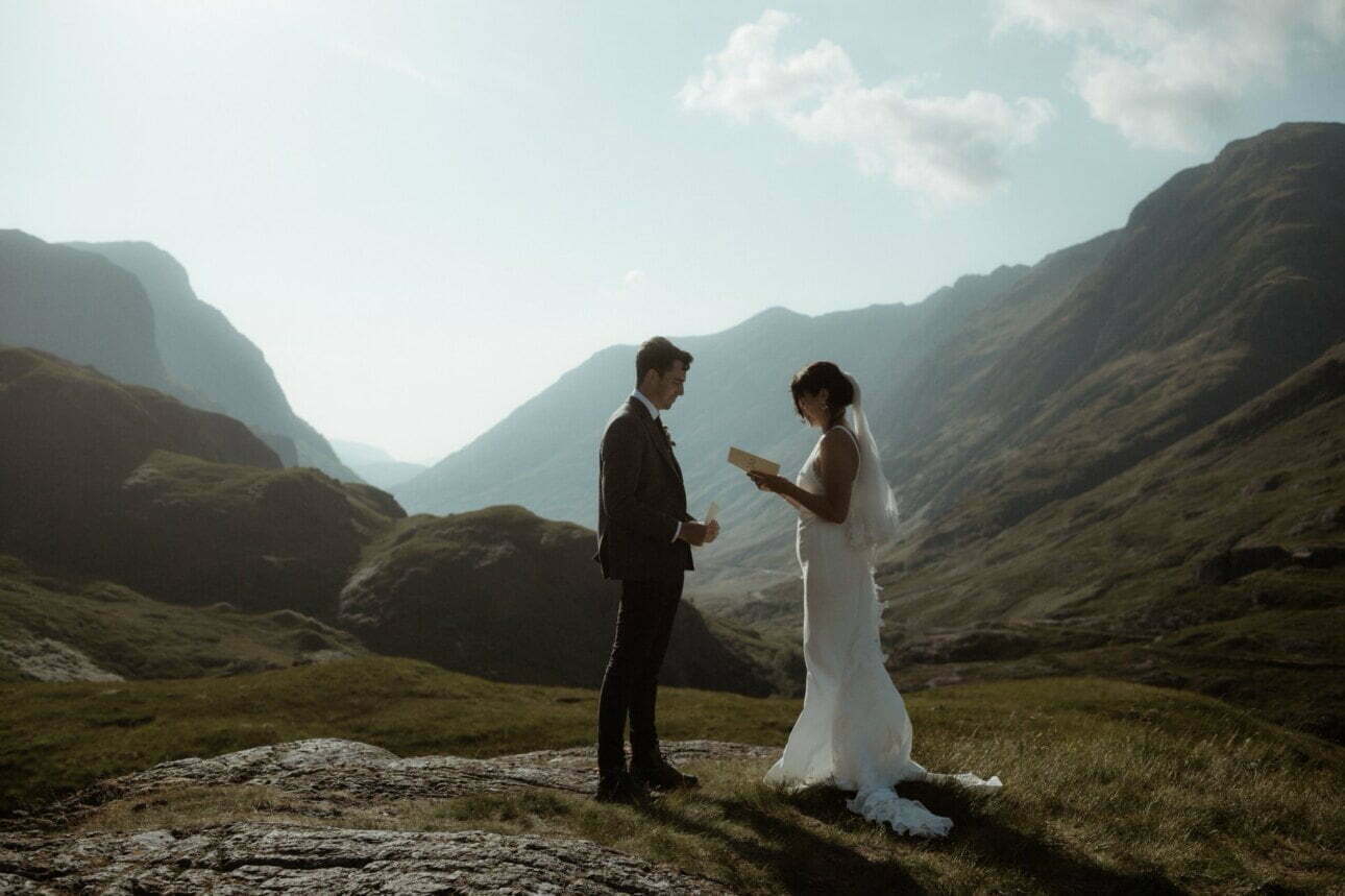 Glencoe elopement in scotland couple walking in the rain in Scotlands mountains