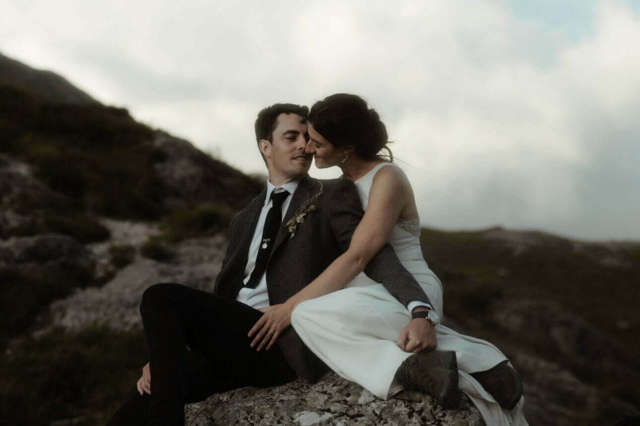 couple hugging in Glencoe during their Scottish elopement