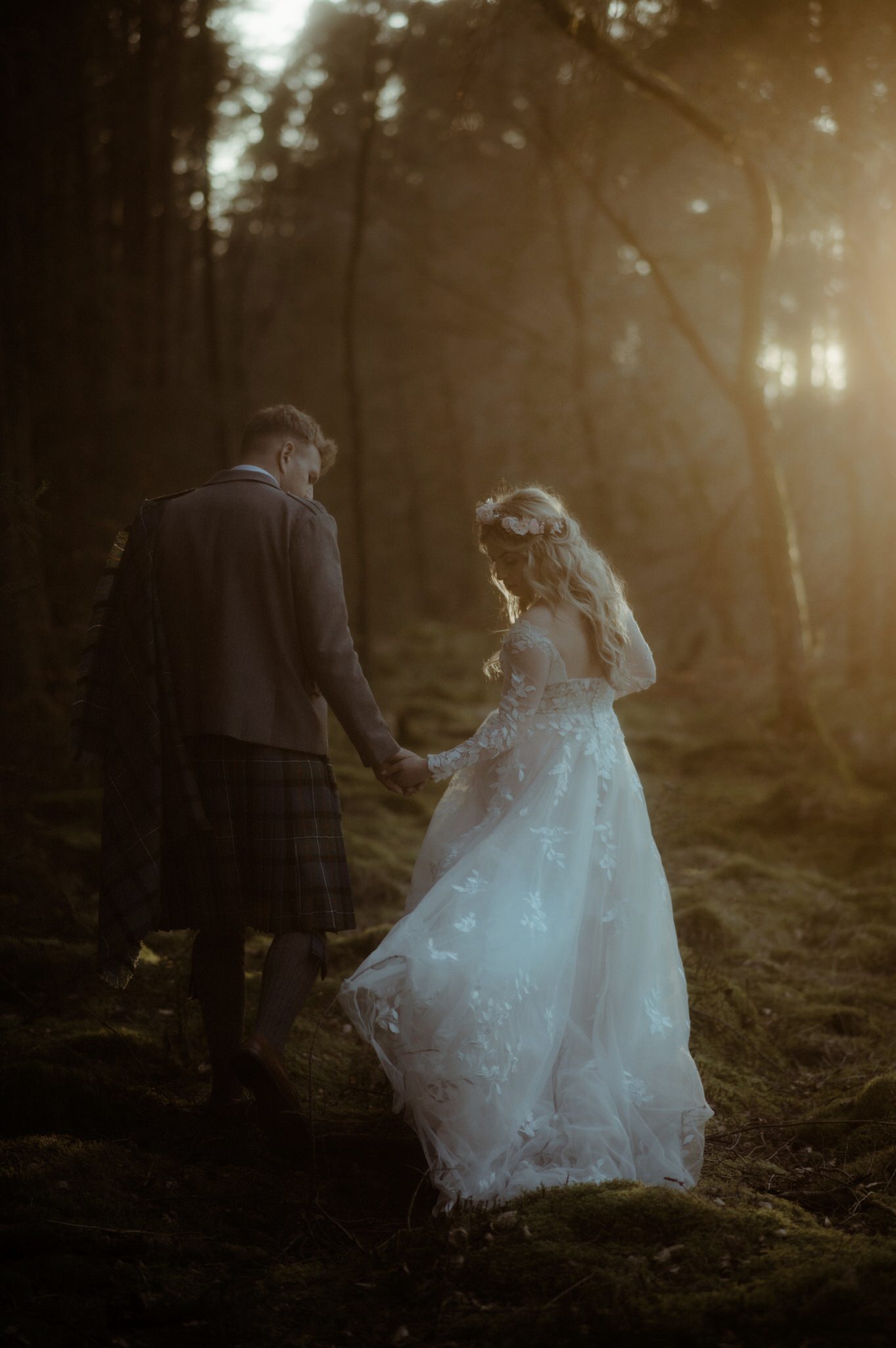 elope to scotland couple walking in woodland