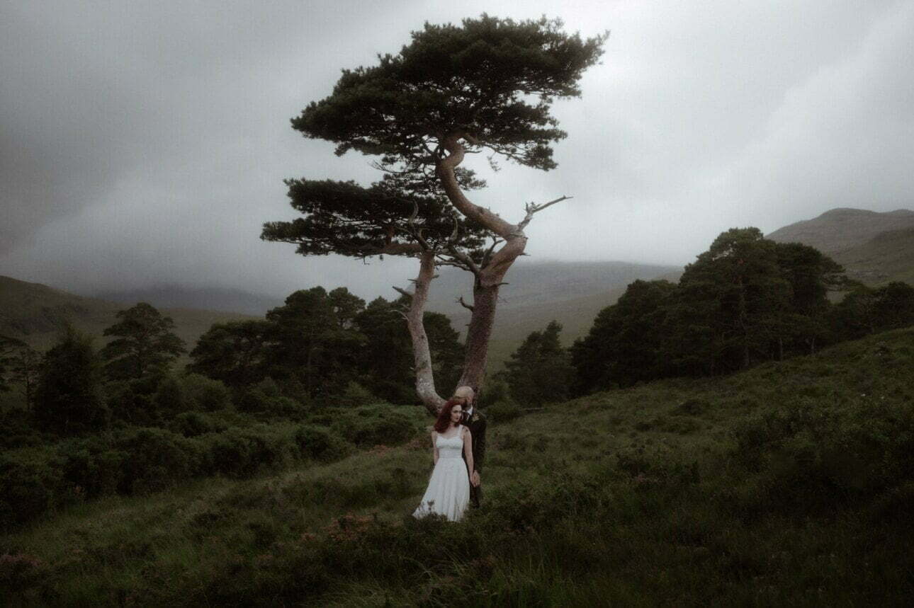 elope in scotland couple standing in the mountains