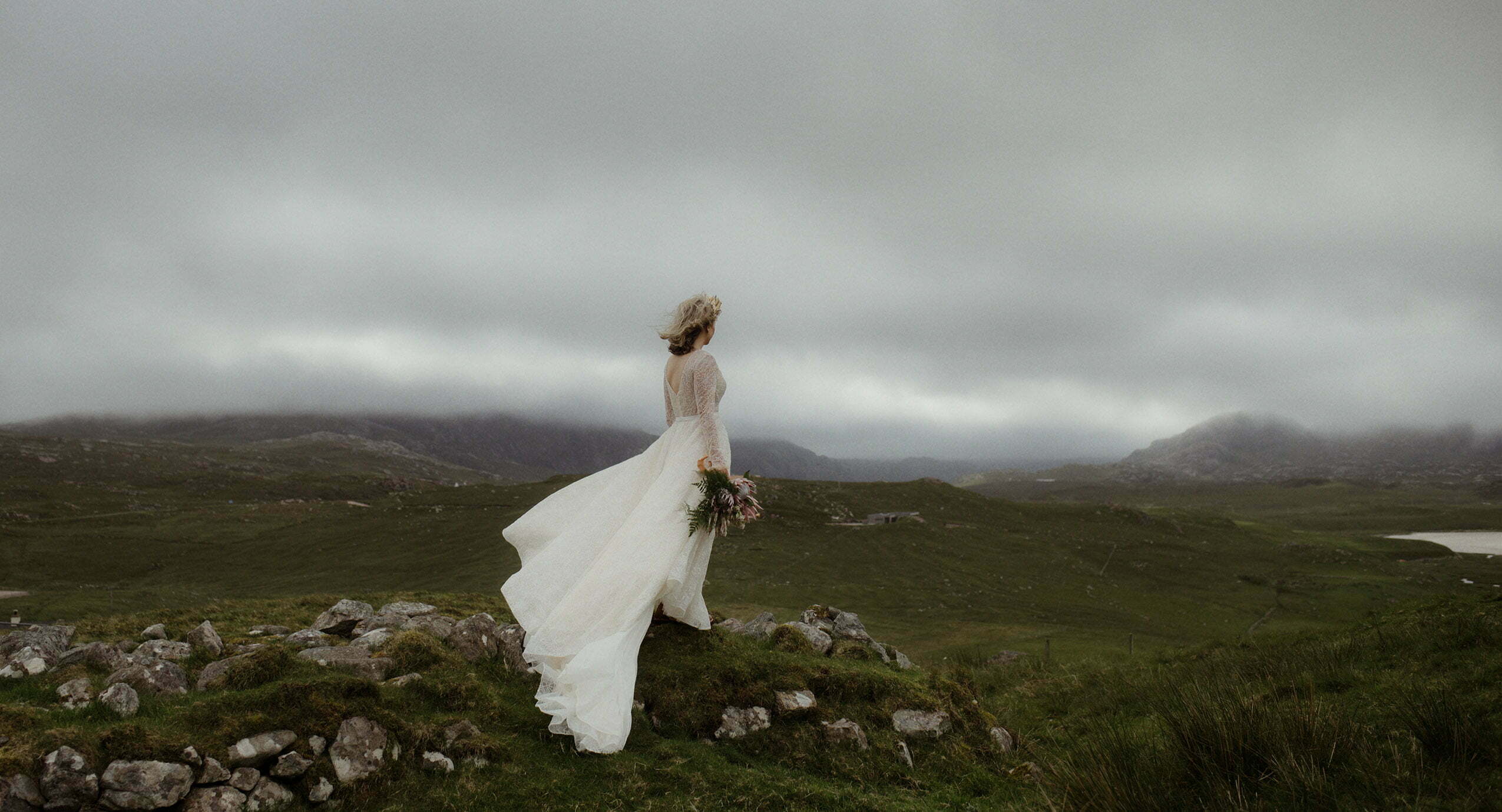 Scotland wedding photographer image of bride standing near a beach on the Isle of lewis before her hebridean elopement