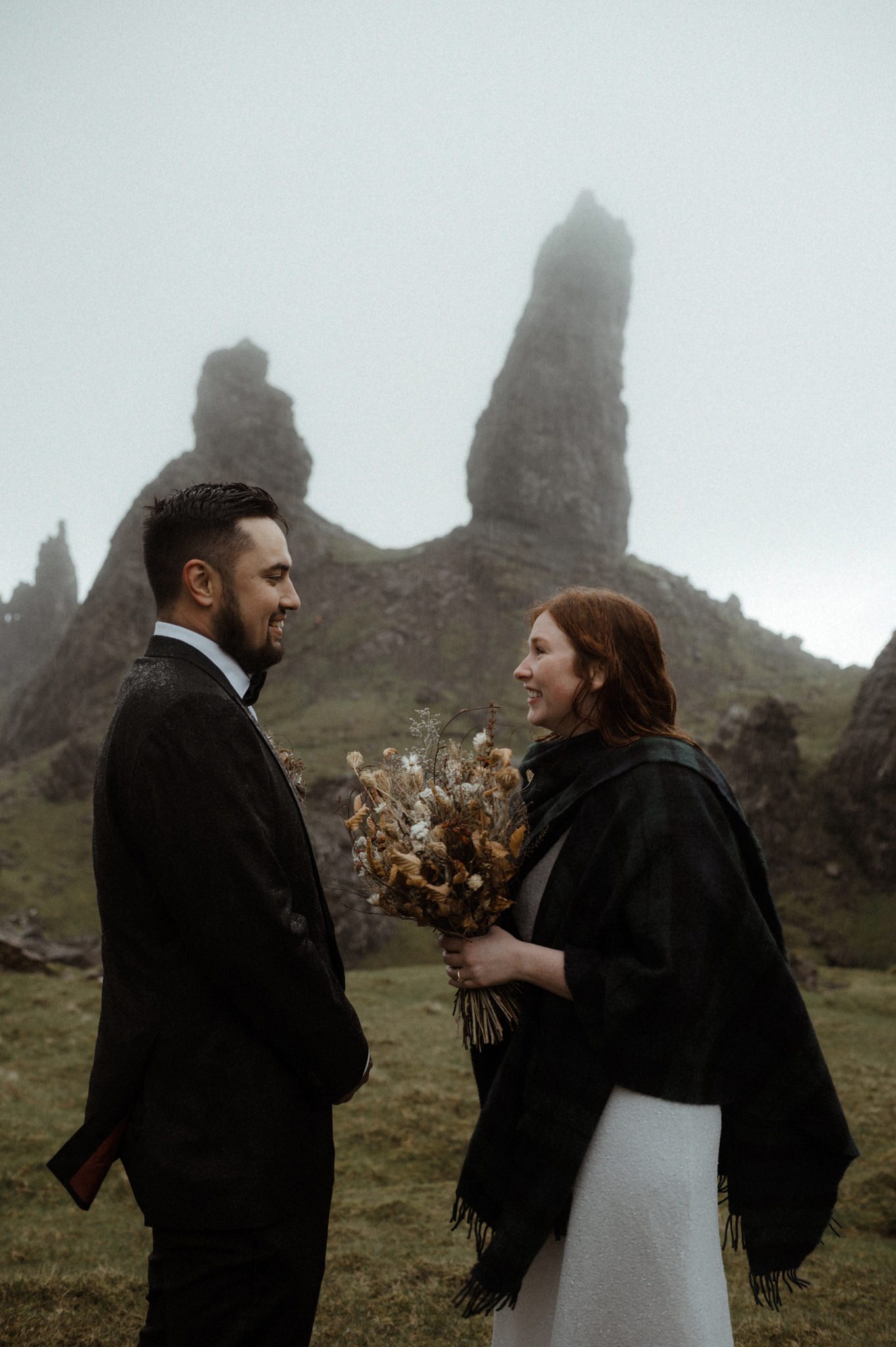 A wedding taking place in Scotland outdoors in the rain