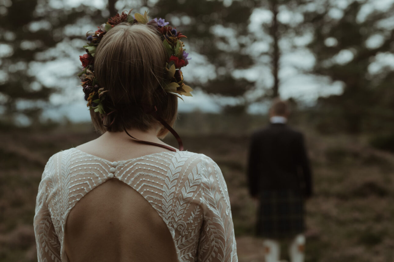 Groom waiting for first look in Woodland during a Scottish elopement