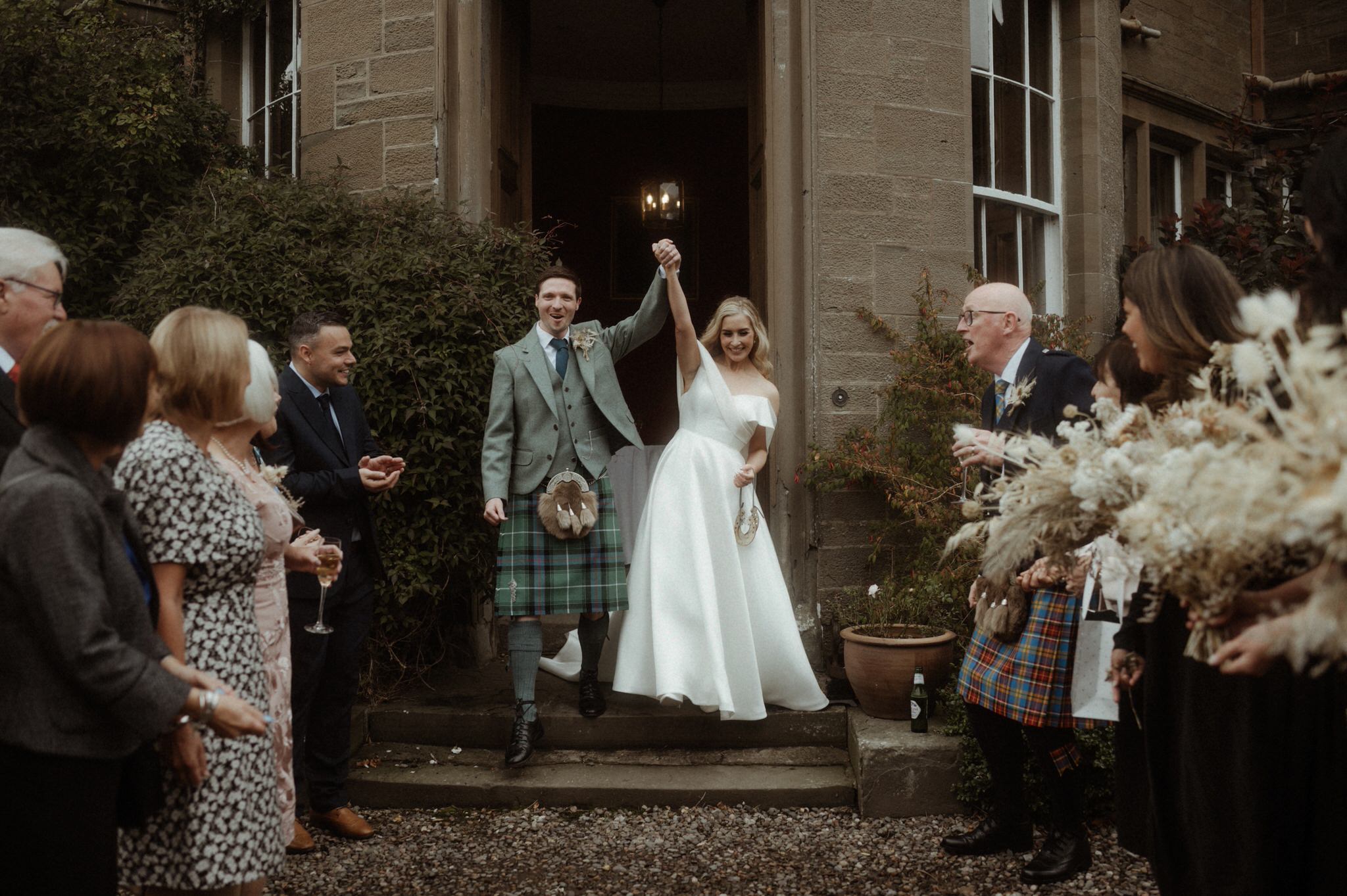 confetti throw during a wedding at birkhill house in Scotland with Bride and groom running and laughing