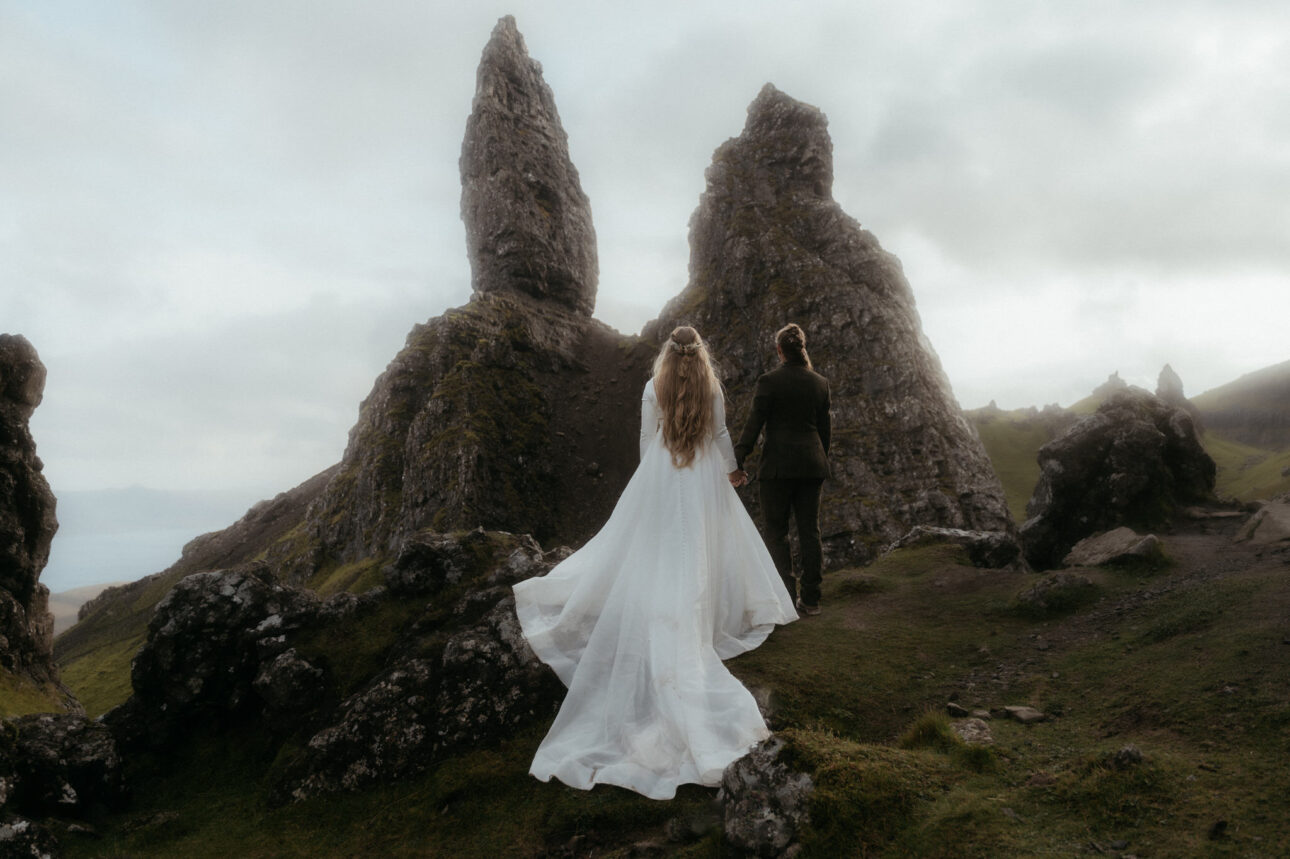 two brides standing at the old man of storr on the Isle of Skye during their elopement