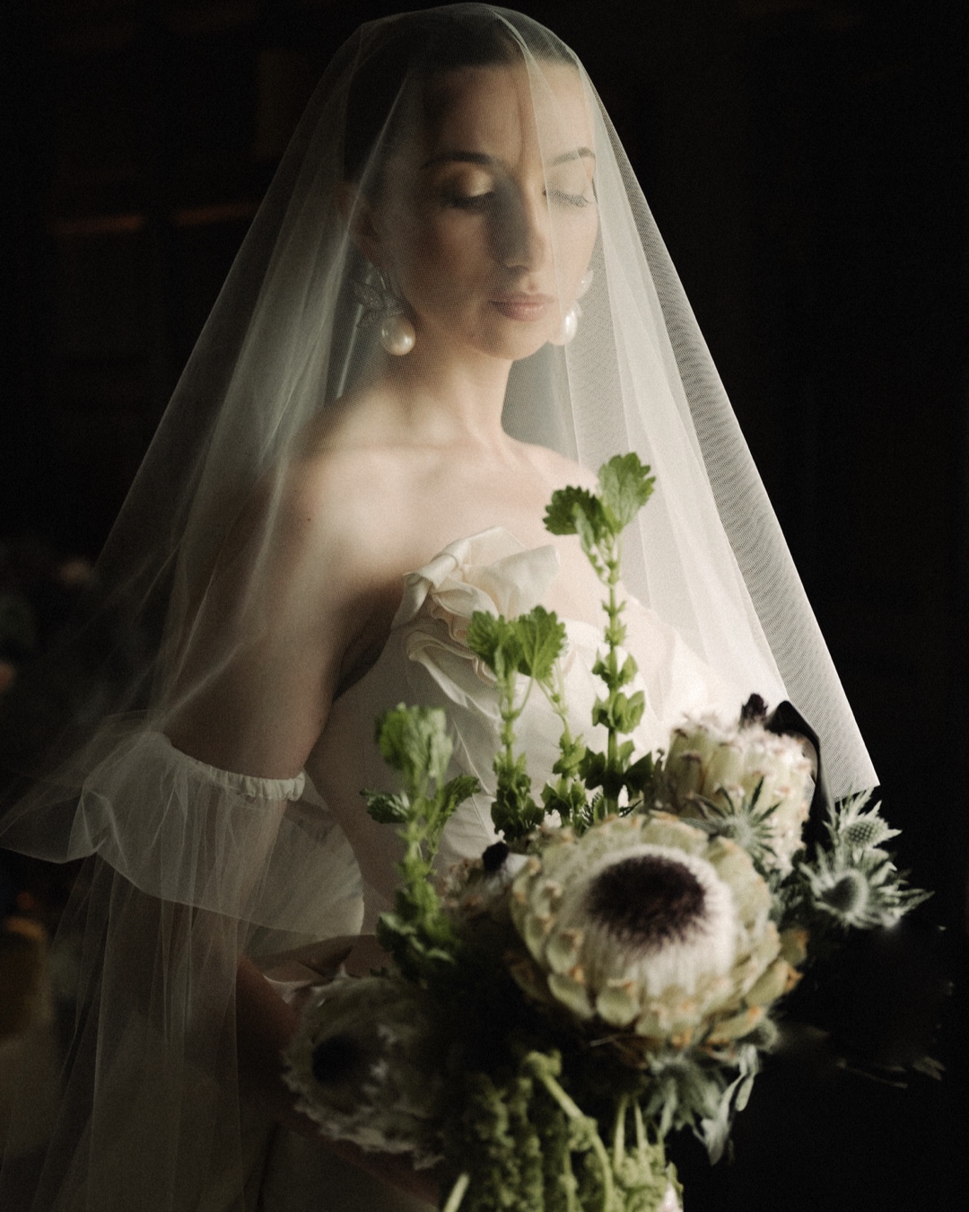 elope to scotland bride in a window